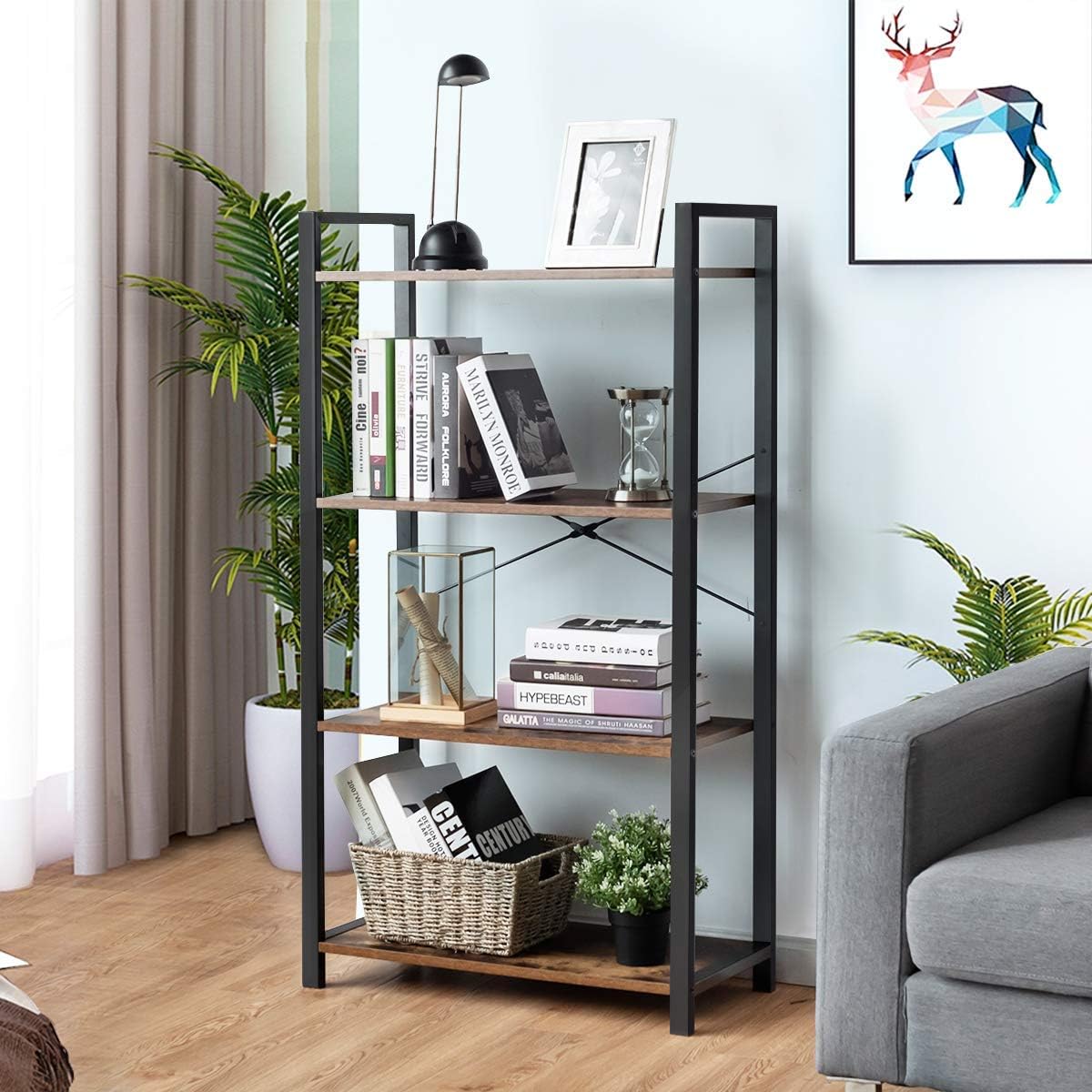 A black 4-shelf industrial book rack with a rustic brown MDF top, placed in a living room setting with books, plants, and decorative items on the shelves.