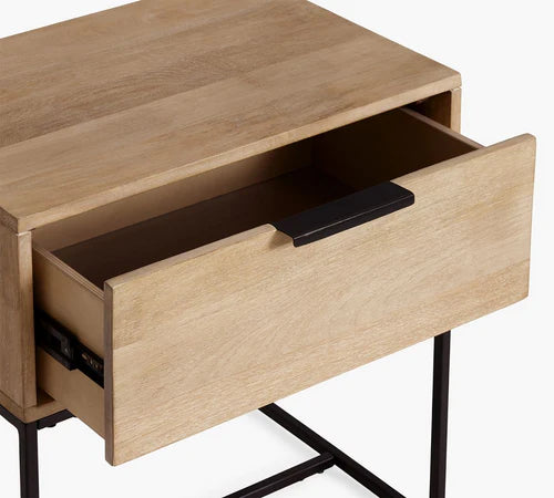 Close-up of open drawer on modern side table, white background