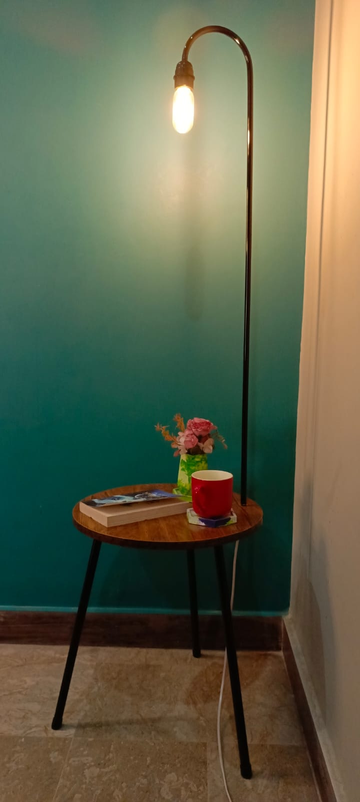 Close-up of wooden surface and modern lamp fixture on fancy floor lamp table