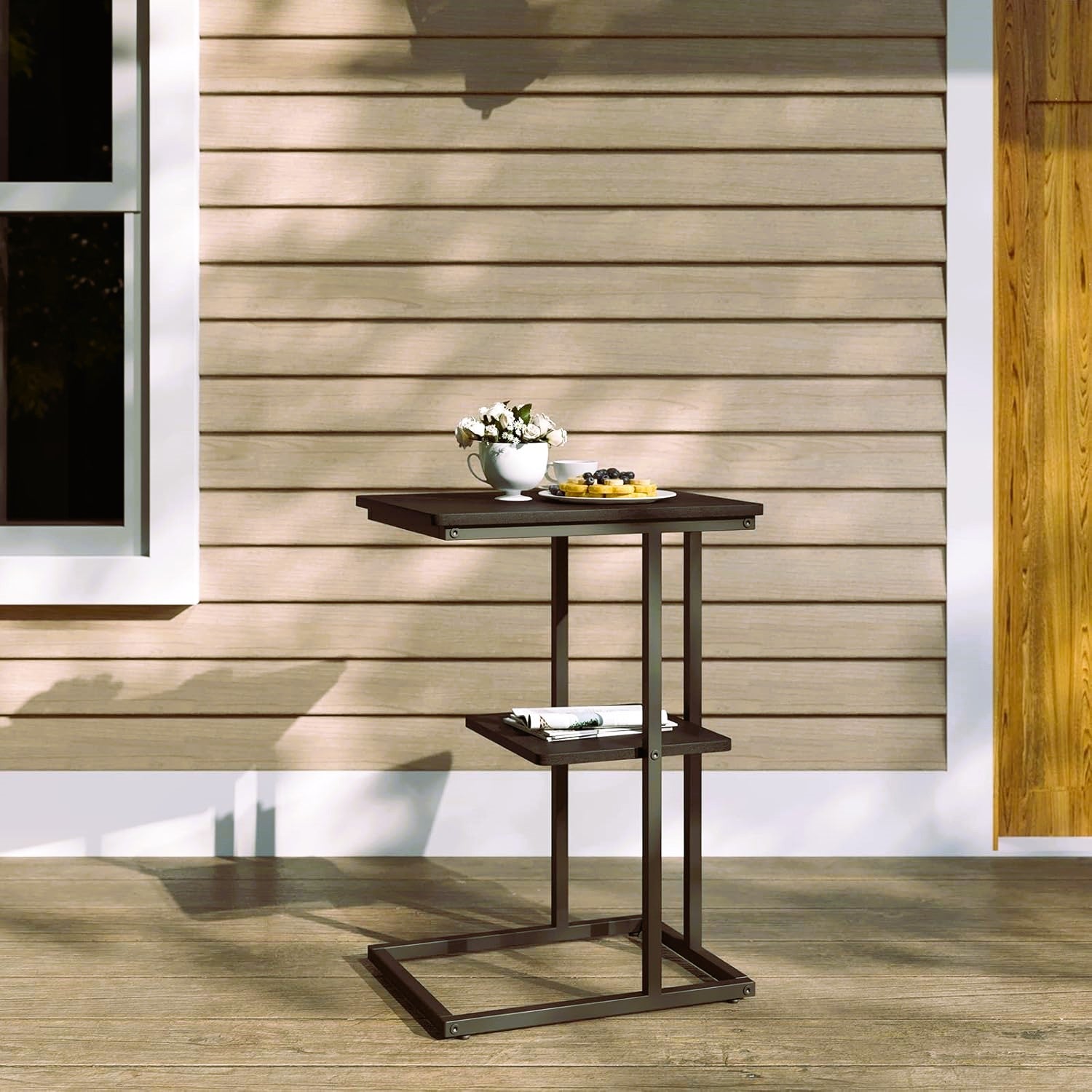 2-tier night stand with dark walnut finish and black frame beside a bed – MetalX