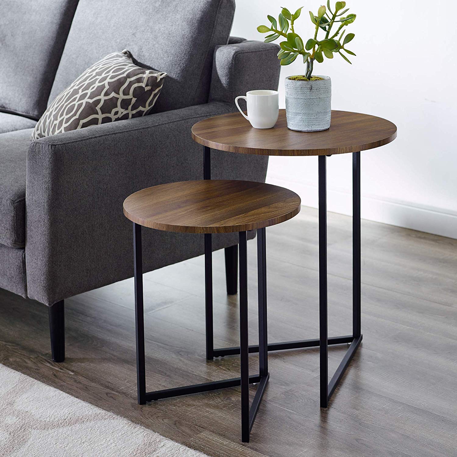 Modern nesting coffee tables with walnut tops and black metal frames placed in real setup β MetalX