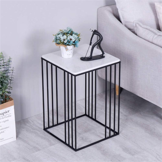 KOOU coffee table with marble texture top and black frame styled in a cozy living room – MetalX