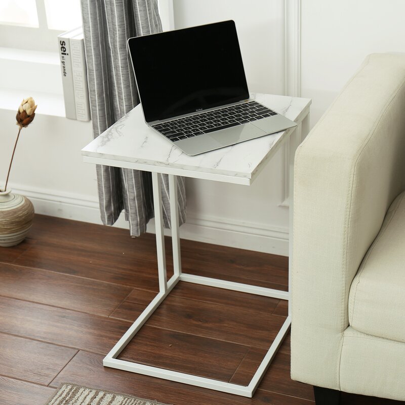 Multipurpose laptop table with walnut finish top and black frame placed in front of sofa – MetalX