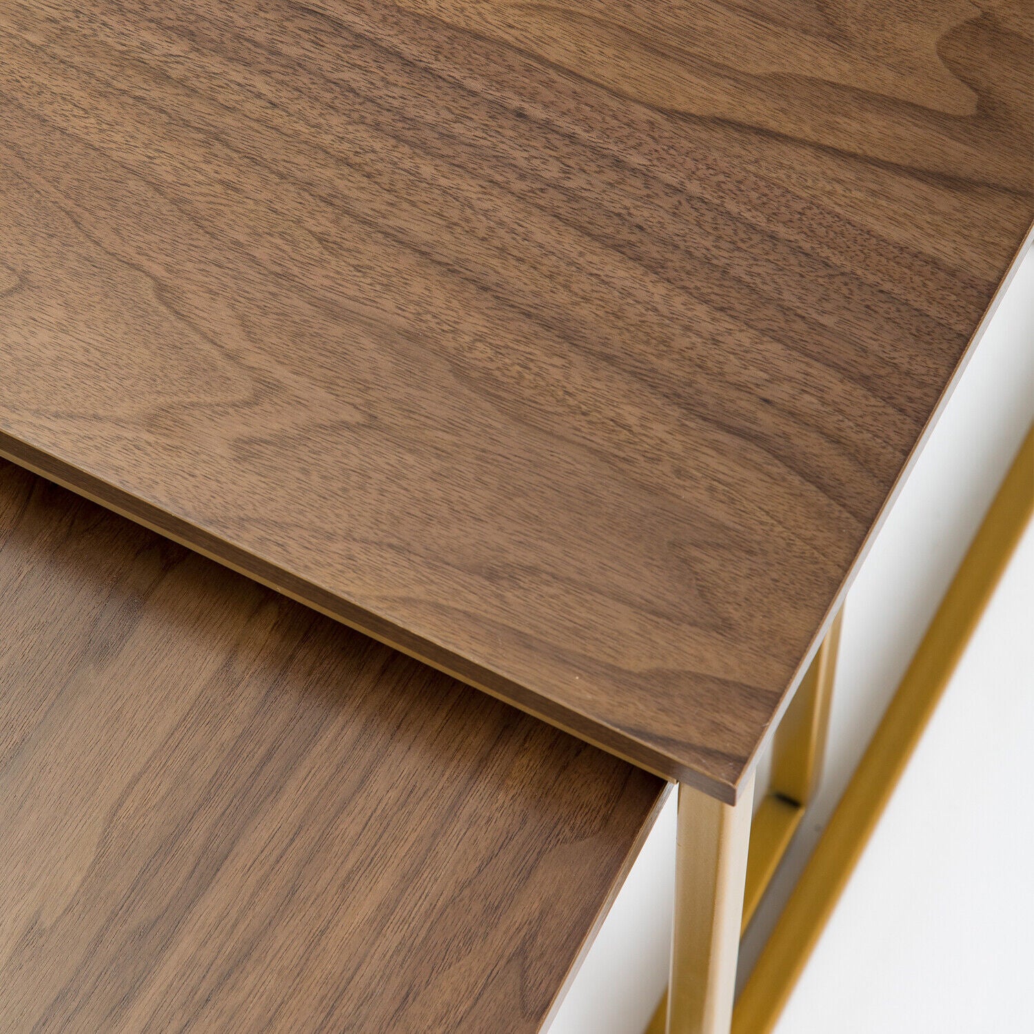 Close-up of MetalX walnut top nesting table with gold frame – detailed surface texture