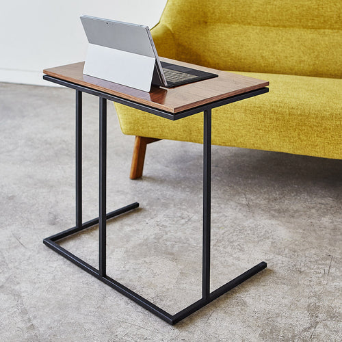 Portable laptop stand in real-world home setting, ideal for bed or sofa use – MetalX