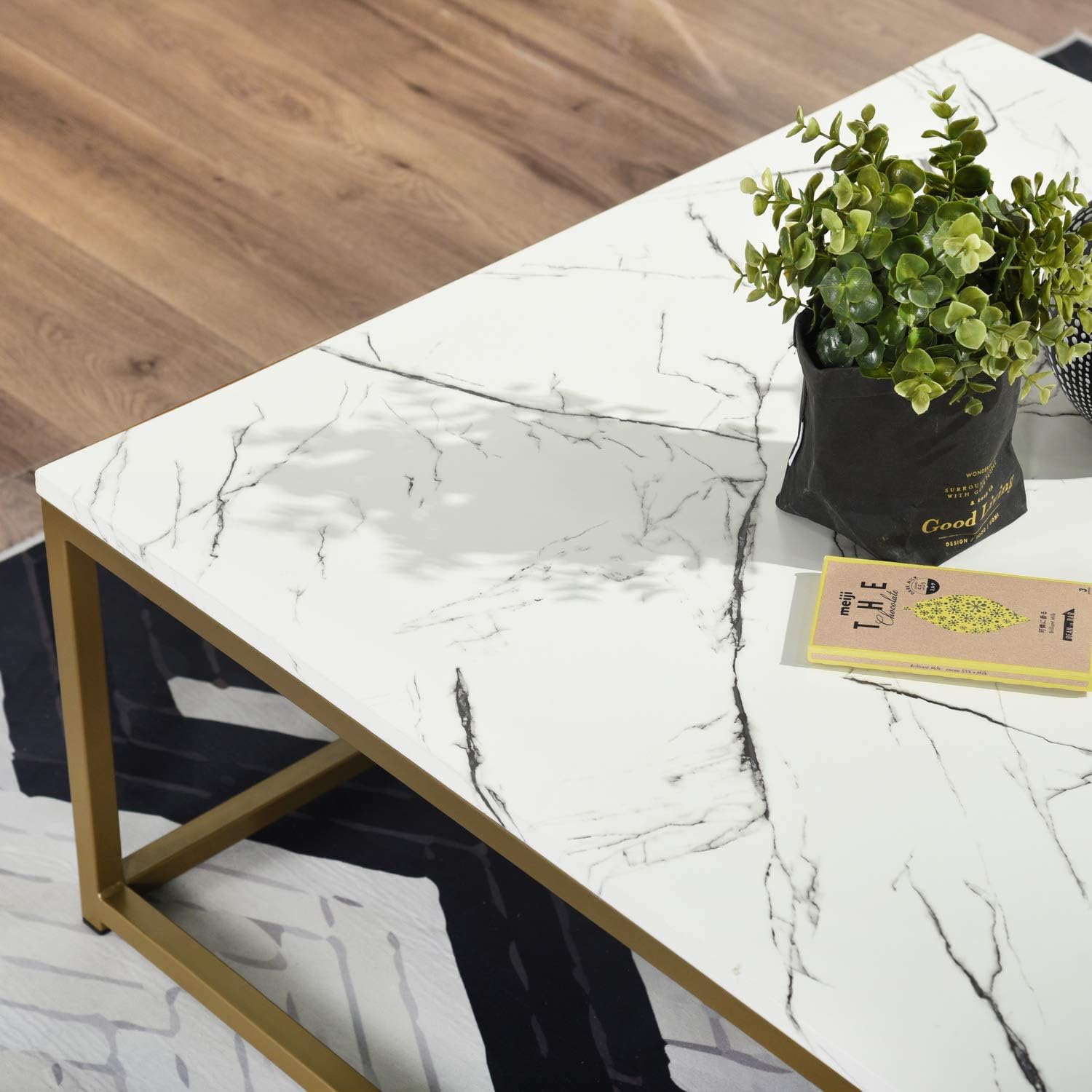 Top view of MetalX square marble coffee table showing white marble texture and gold frame