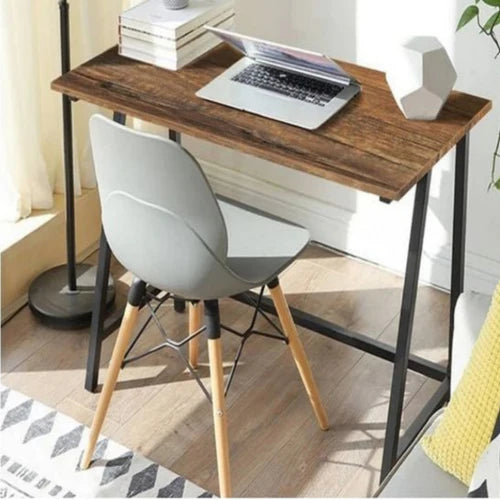 Home study table with walnut top and black metal frame in a workspace setup – MetalX