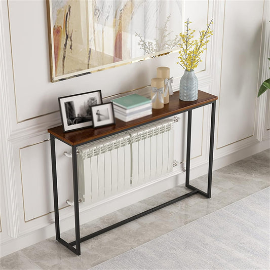 A narrow console table with a black metal frame and a wood-finished MDF desktop, featuring a set of drawers and a shelf with decorative items on top.