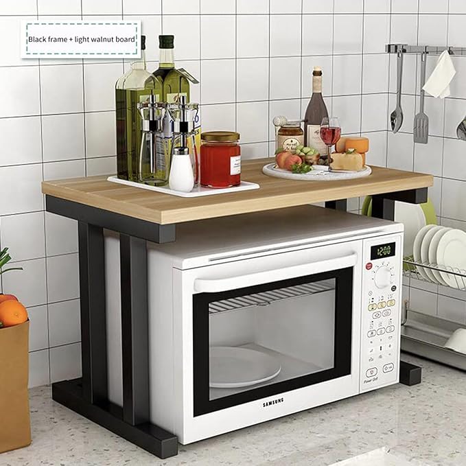 Kitchen setup with a wooden countertop, Samsung microwave, and various kitchen items.