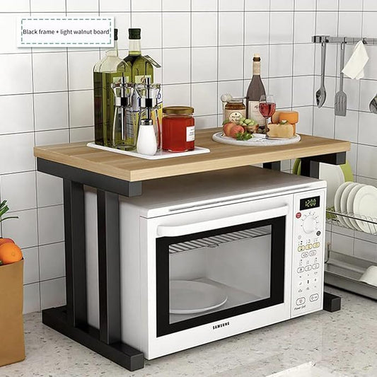 Kitchen setup with a wooden countertop, Samsung microwave, and various kitchen items.