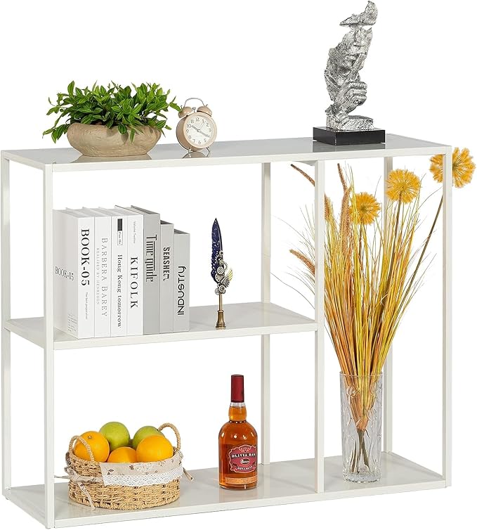 White shelving unit with decorative items including books, a plant, a bottle, and a vase.