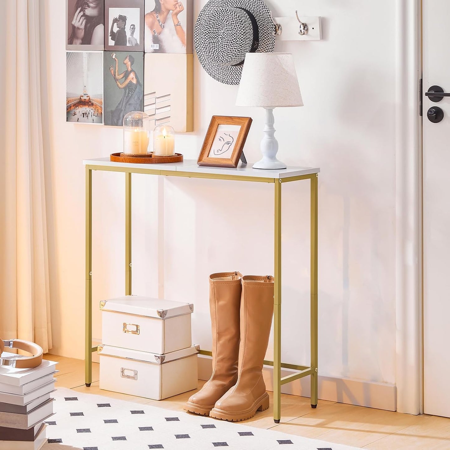 Console table with gold frame and white top in a room setting with decor elements.