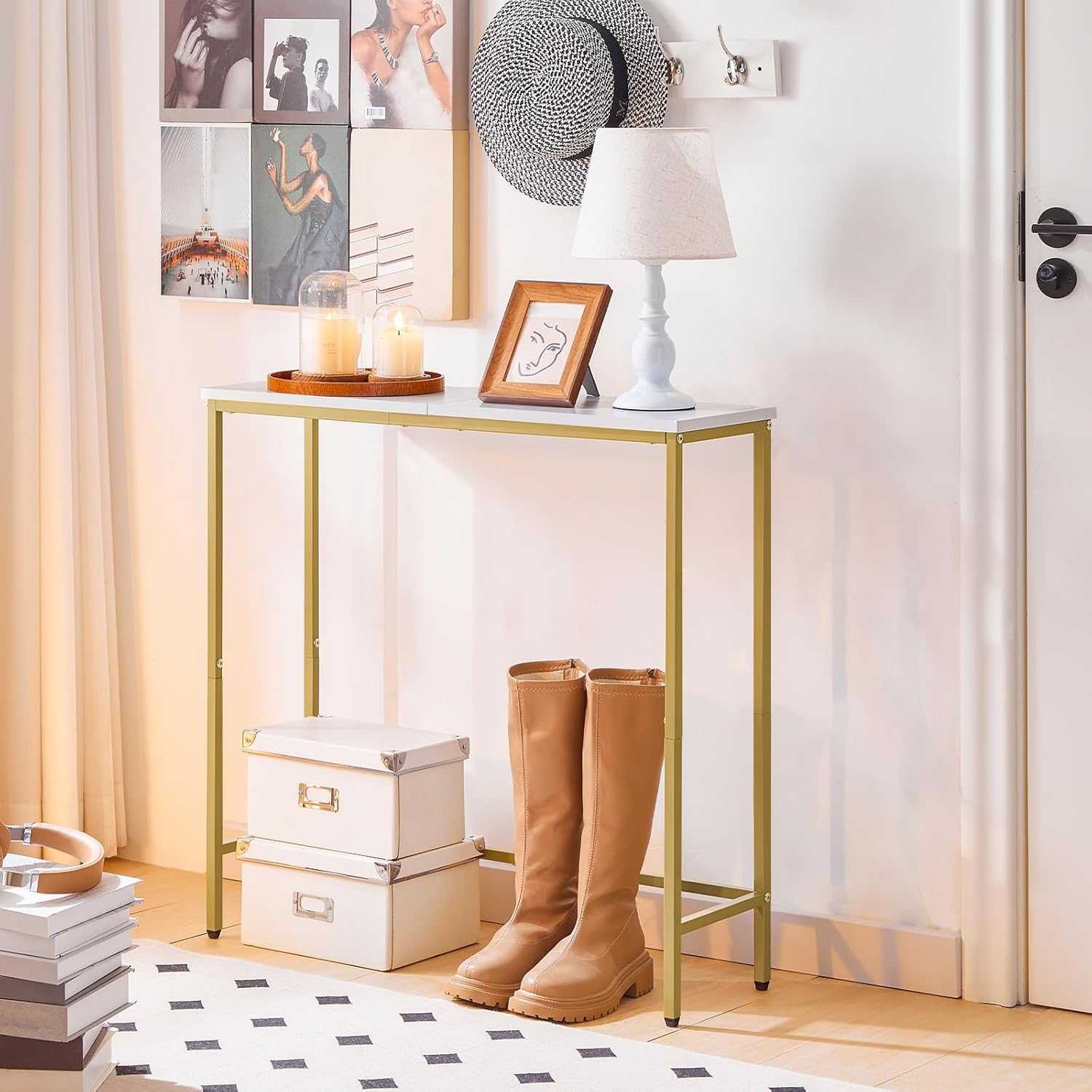 Console table with gold frame and white top in a room setting with decor elements.