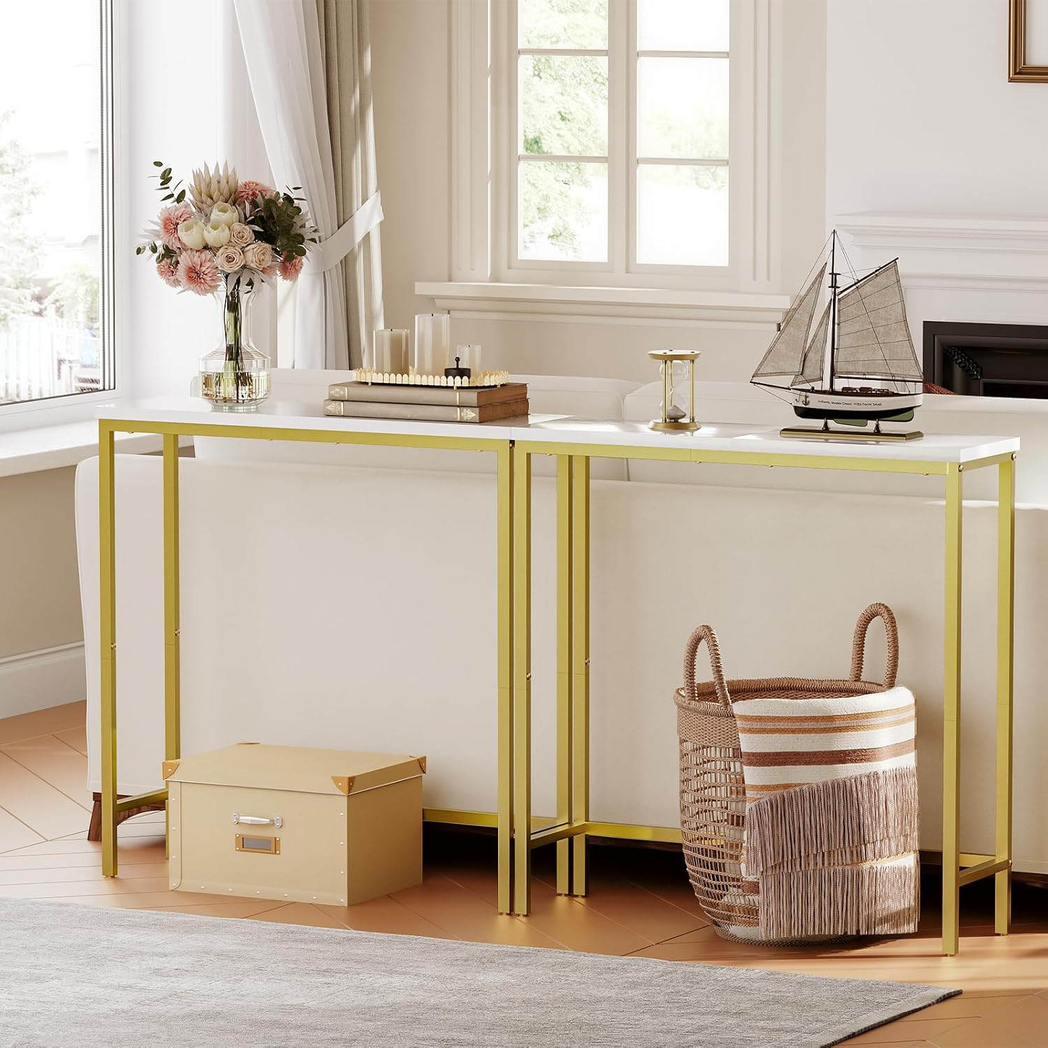 Modern desk with gold legs in a bright room with large windows.