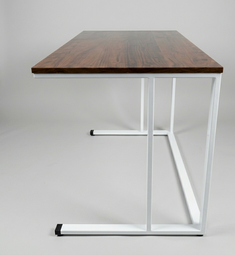 Wooden desk with metal frame on a plain background