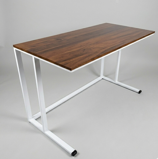 Wooden desk with white metal legs on a gray background